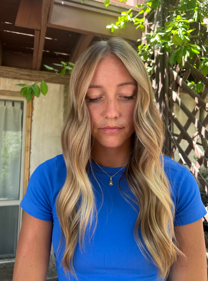 Long golden blonde waves with face-framing layers